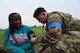Airman 1st Class Thomas Sexton, 5th Medical Group (5MDG) medical technician, checks the blood pressure of Folashade Ajulo, 5MDG disease manager, at Minot Air Force Base, North Dakota, June 11, 2025. Sexton checked Ajulo’s blood pressure to sharpen his speed and accuracy with recording diagnostics during an emergency exercise. (U.S. Air Force photo by Airman 1st Class Anthony Ramey.)