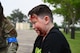 Logan Scirica, a civilian, poses as a victim of a traumatic incident at Minot Air Force Base, North Dakota, June 11, 2025. Scirica’s face was covered in moulage to enhance realism during the 5th Medical Groups emergency response exercise. (U.S. Air Force photo by Airman 1st Class Anthony Ramey.)