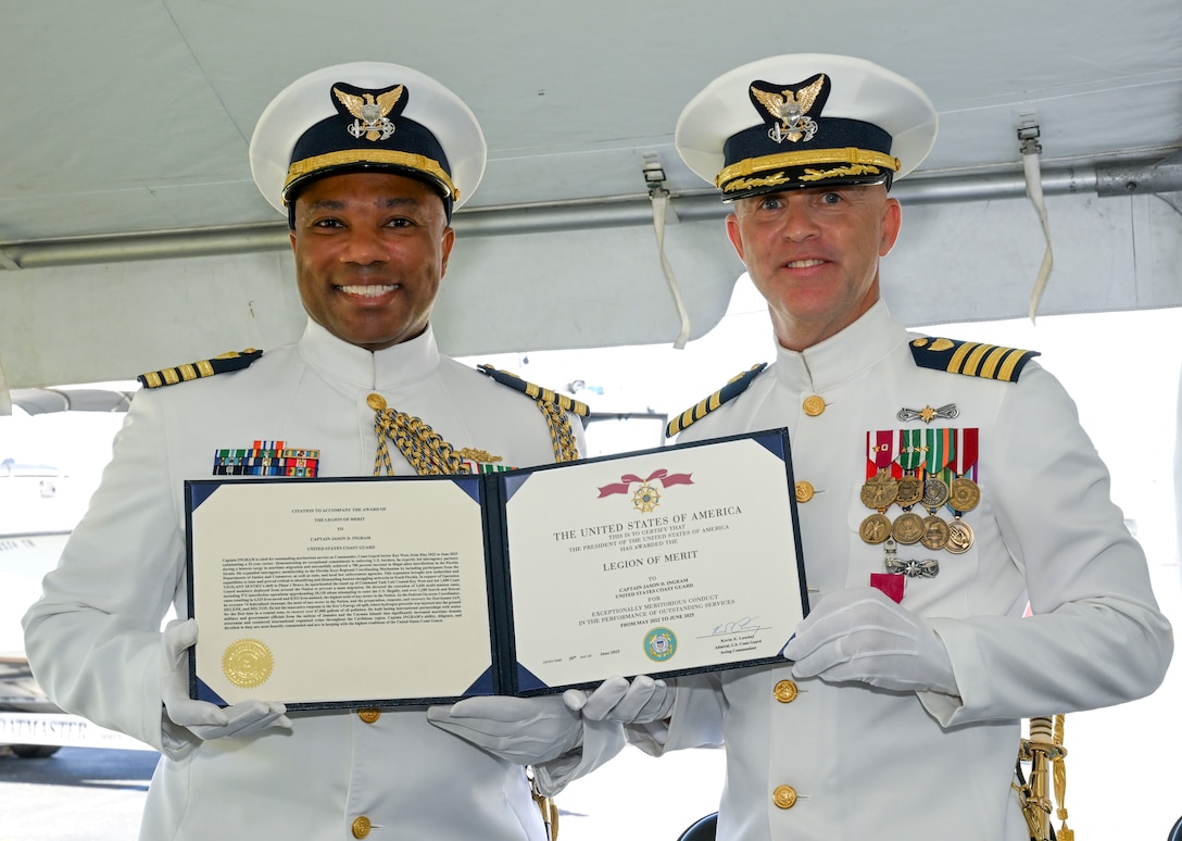 Capt. Willie L. Carmichael, Seventh Coast Guard District chief of staff, awards Capt. Jason Ingram with the Legion of Merit award for his outstanding service and devotion to duty as commander of Sector Key West, June 20, 2025. Capt. Ingram was commander of Sector Key West from May 2022 to June 2025. (U.S. Coast Guard photo by Petty Officer 2nd Class Eric Rodriguez)