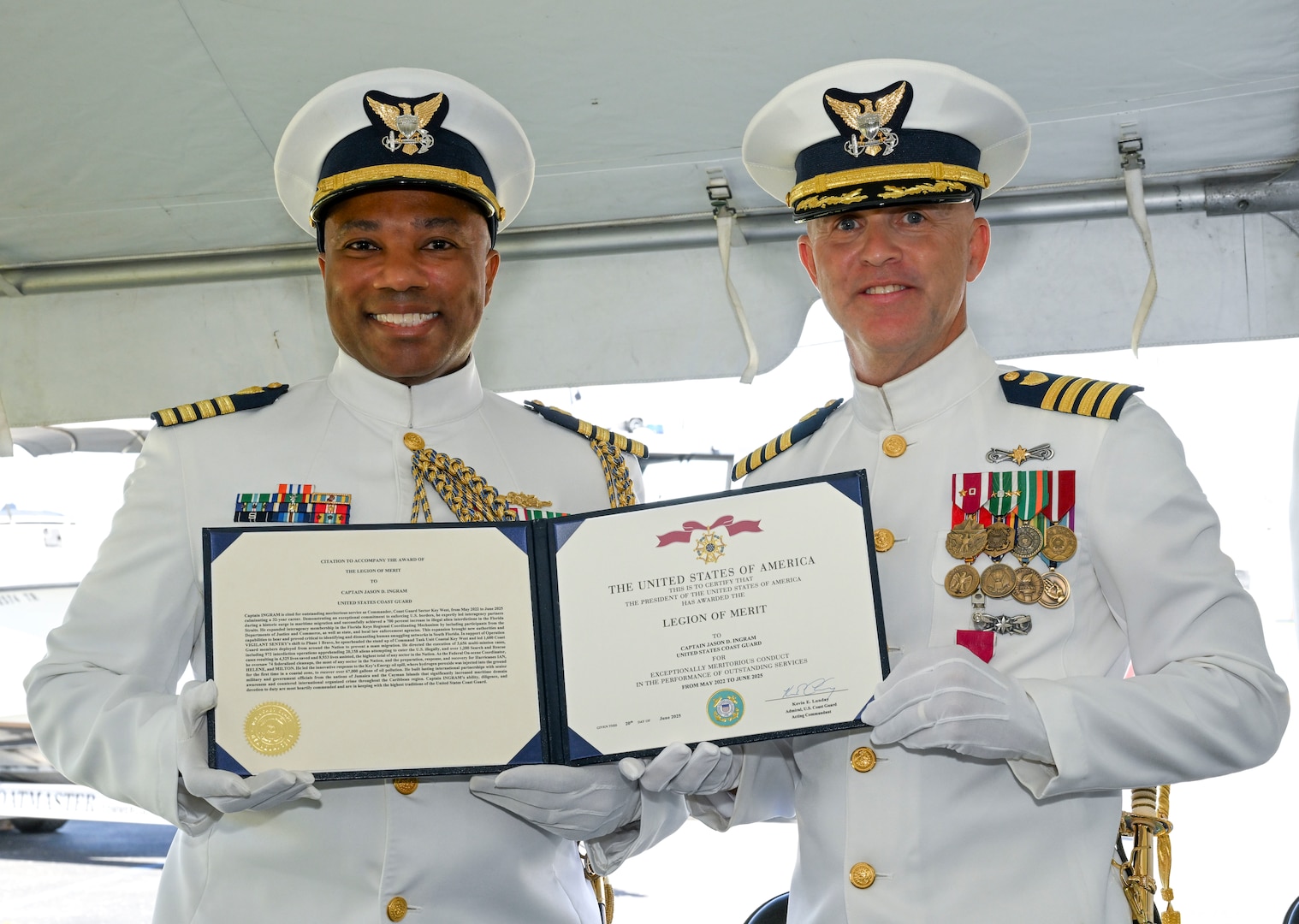 Capt. Willie L. Carmichael, Seventh Coast Guard District chief of staff, awards Capt. Jason Ingram with the Legion of Merit award for his outstanding service and devotion to duty as commander of Sector Key West, June 20, 2025. Capt. Ingram was commander of Sector Key West from May 2022 to June 2025. (U.S. Coast Guard photo by Petty Officer 2nd Class Eric Rodriguez)