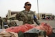 U.S. Air Force Staff Sgt. Jamila Jones, a 5th Medical Group (5MDG) medical technician, poses in front of a manikin at Minot Air Force Base, North Dakota, June 11, 2025. The 5MDG used manikins to assist in training Airmen to assess and treat injuries. (U.S. Air Force photo by Airman 1st Class Anthony Ramey.)