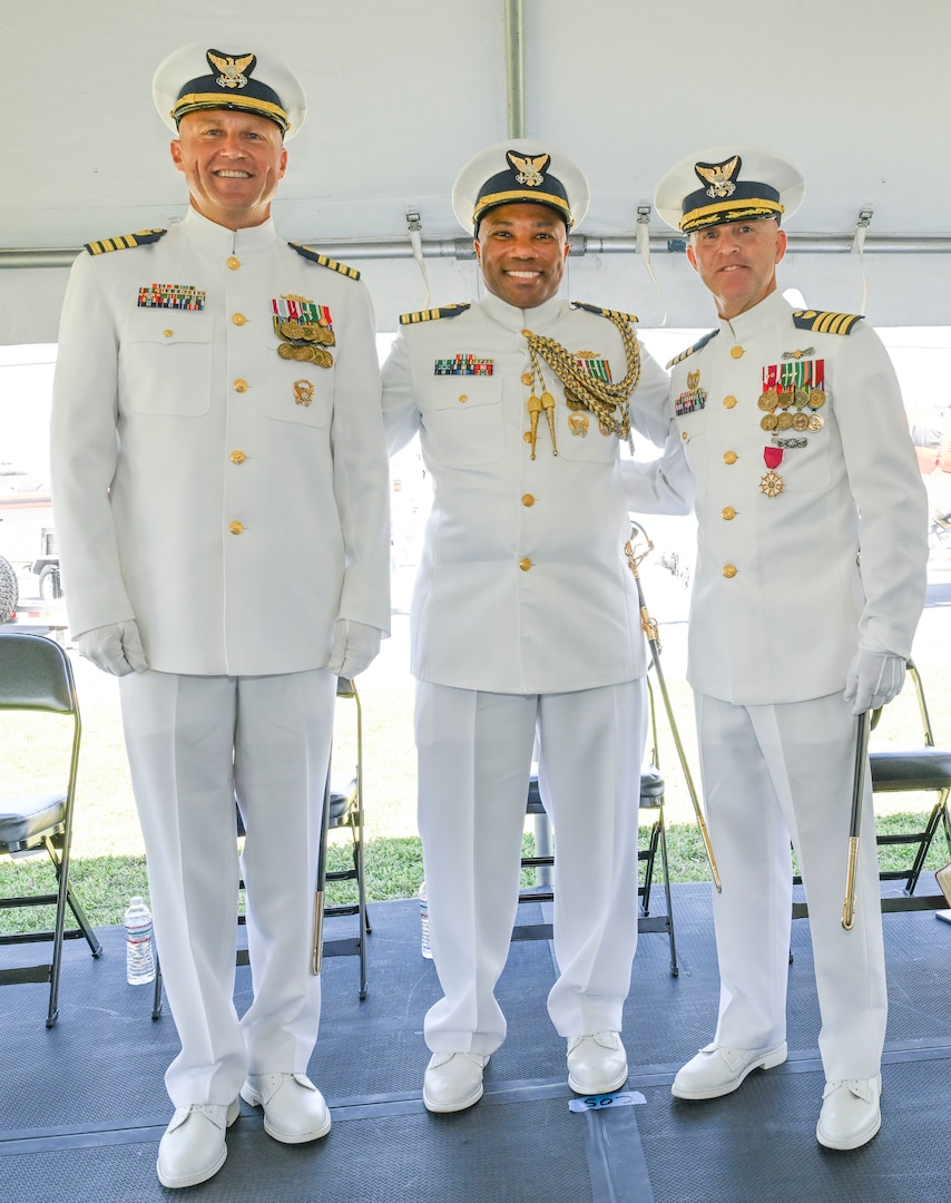 Capt. Joshua Empen, Capt. Willie L. Carmichael and Capt. Jason Ingram, stand for a photo at the conclusion of a change of command ceremony at U.S. Coast Guard Sector Key West, June 20, 2025. 
The change of command ceremony is a time-honored tradition that represents a total transfer of responsibility, authority and accountability from one individual to another. (U.S. Coast Guard photo by Petty Officer 2nd Class Eric Rodriguez)