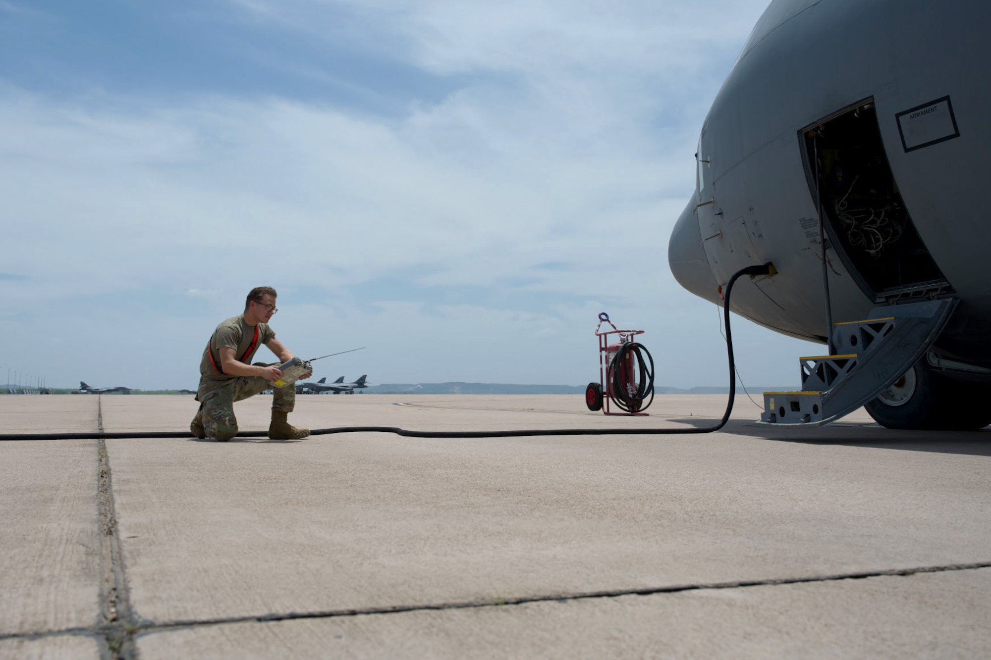 U.S. Air Force Airman 1st Class Daniel Stang, 317th Aircraft Maintenance Squadron avionics technician, scans for frequency interference with a spectrum analyzer, at Dyess Air Force Base, Texas, June 2, 2025. The communication upgrades enhance secure, in-flight connectivity for C-130J operations. (U.S. Air Force photo by Senior Airman Emma Anderson)