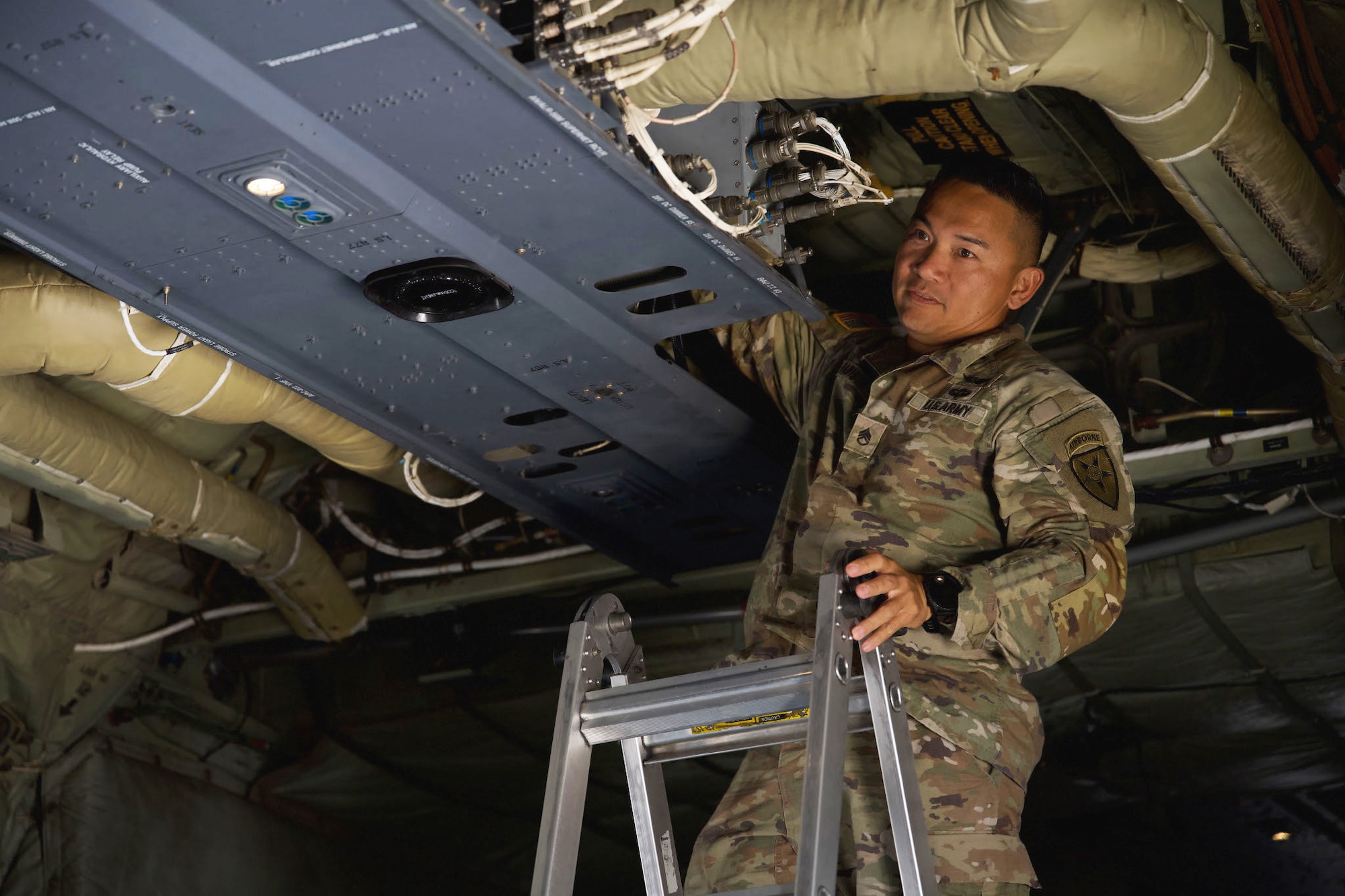 U.S. Army Staff Sgt. Kenneth Babista, 4th Joint Communications Support Element enroute engineer, installs an ultra-high frequency satellite communication antenna at Dyess Air Force Base, Texas, June 3, 2025. The antenna supports agile operations aligned with adaptive basing and resilient communications goals. (U.S. Air Force photo by Senior Airman Emma Anderson)