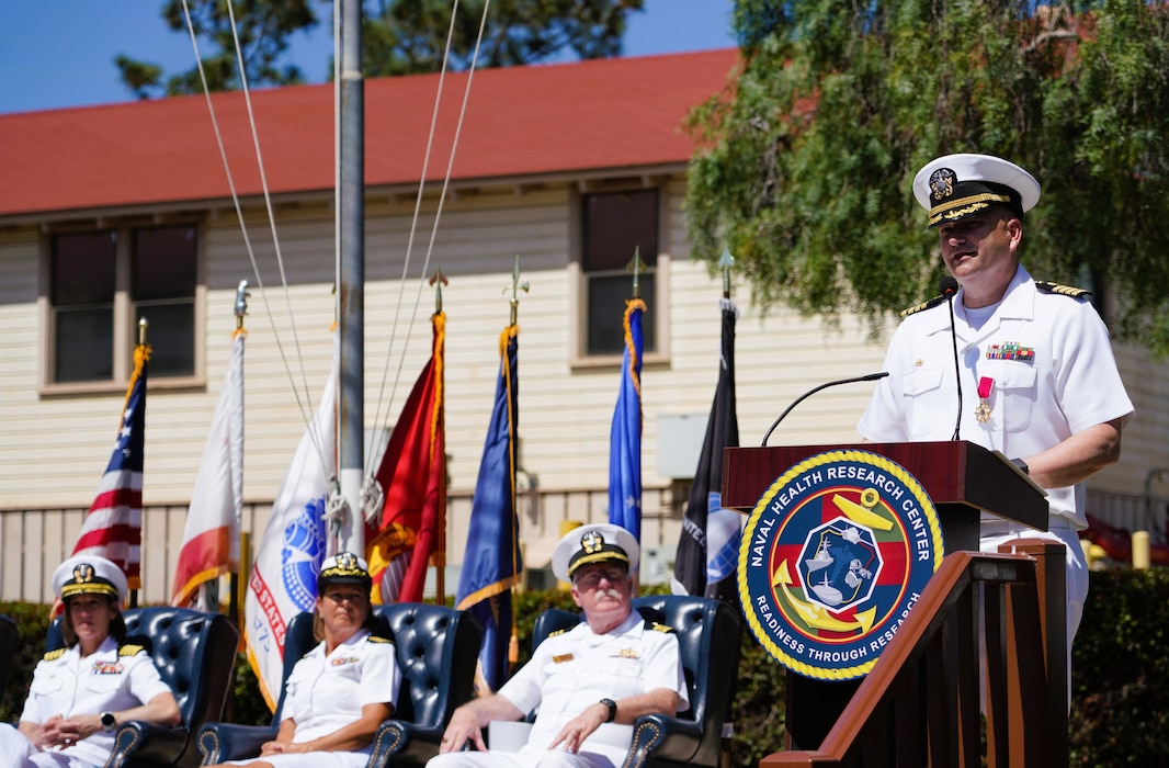 SAN DIEGO (June 17, 2025) Capt. Eric Welsh speaks at Naval Health Research Center’s (NHRC) change of command ceremony. The ceremony’s presiding officer, Capt. Franca Jones, commander, Naval Medical Research Center, was joined on stage by Capt. Kellie McMullen and Lt. Cdr. Michael Geoghegan. The ceremony, presided over by Jones, saw Welsh relieved as commanding officer, NHRC by McMullen. NHRC, part of Navy Medicine Research & Development, supports Navy, Marine Corps, and joint U.S. warfighter health readiness and lethality with research and development that delivers high-value, high-impact solutions to the health and readiness challenges U.S. military population faces on the battlefield, at-sea, home and abroad. (U.S. Navy photo by Danielle Cazarez)