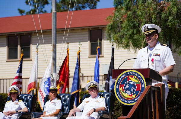 SAN DIEGO (June 17, 2025) Capt. Eric Welsh speaks at Naval Health Research Center’s (NHRC) change of command ceremony. The ceremony’s presiding officer, Capt. Franca Jones, commander, Naval Medical Research Center, was joined on stage by Capt. Kellie McMullen and Lt. Cdr. Michael Geoghegan. The ceremony, presided over by Jones, saw Welsh relieved as commanding officer, NHRC by McMullen. NHRC, part of Navy Medicine Research & Development, supports Navy, Marine Corps, and joint U.S. warfighter health readiness and lethality with research and development that delivers high-value, high-impact solutions to the health and readiness challenges U.S. military population faces on the battlefield, at-sea, home and abroad. (U.S. Navy photo by Danielle Cazarez)