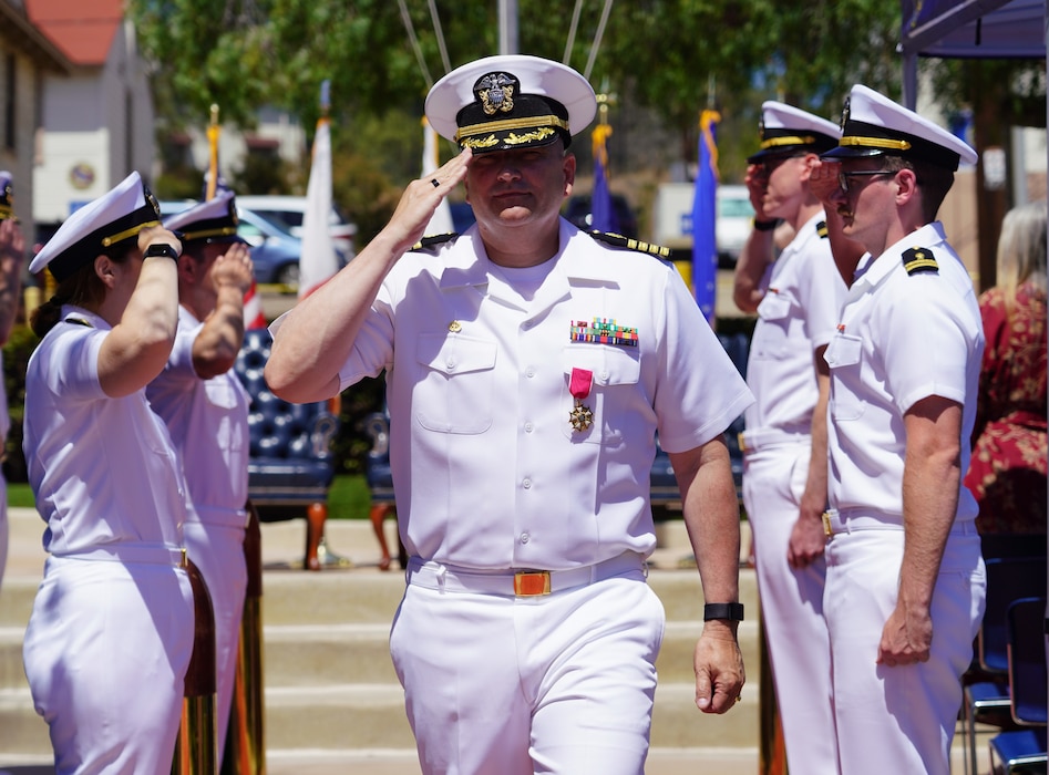 SAN DIEGO (June 17, 2025) Capt. Eric Welsh departs Naval Health Research Center (NHRC) as he passes through side boys at the change of command ceremony in which he is relieved by Capt. Kellie McMullen as commanding officer. NHRC, part of Navy Medicine Research & Development, supports Navy, Marine Corps, and joint U.S. warfighter health readiness and lethality with research and development that delivers high-value, high-impact solutions to the health and readiness challenges U.S. military population faces on the battlefield, at-sea, home and abroad. (U.S. Navy photo by Danielle Cazarez)