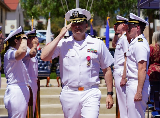 SAN DIEGO (June 17, 2025) Capt. Eric Welsh departs Naval Health Research Center (NHRC) as he passes through side boys at the change of command ceremony in which he is relieved by Capt. Kellie McMullen as commanding officer. NHRC, part of Navy Medicine Research & Development, supports Navy, Marine Corps, and joint U.S. warfighter health readiness and lethality with research and development that delivers high-value, high-impact solutions to the health and readiness challenges U.S. military population faces on the battlefield, at-sea, home and abroad. (U.S. Navy photo by Danielle Cazarez)