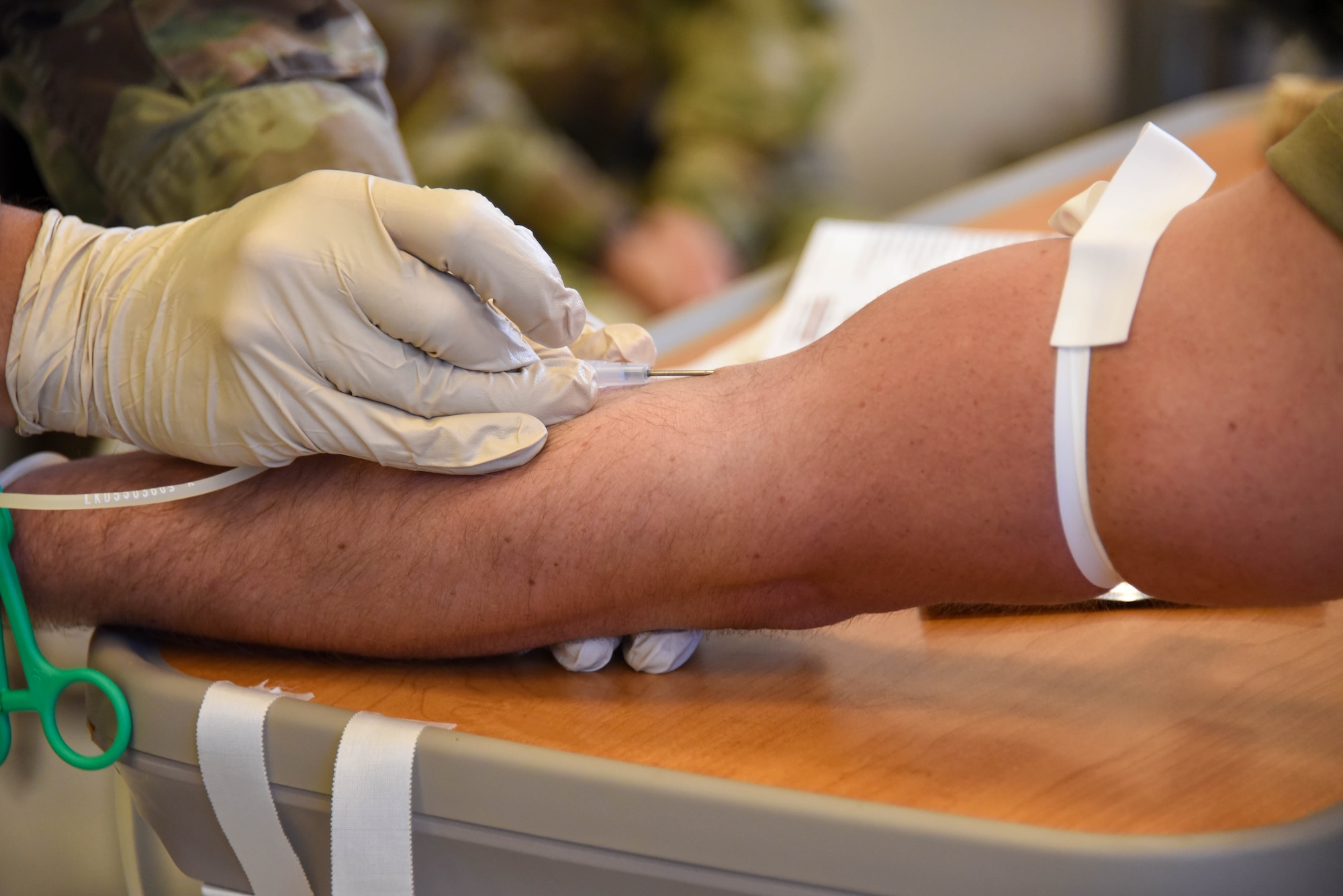 The 185th Air Refueling Wing Medical Group Tech Sgt. Dylan Hinds performs a blood transfusion during their annual training.