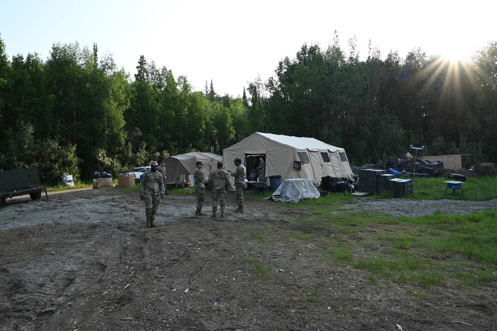 U.S. Air Force Airmen assigned to the 354th Contracting Squadron and 354th Comptroller Squadron discuss their Contingency Contracting Officer briefing at Eielson Air Force Base, Alaska, June 18, 2025.