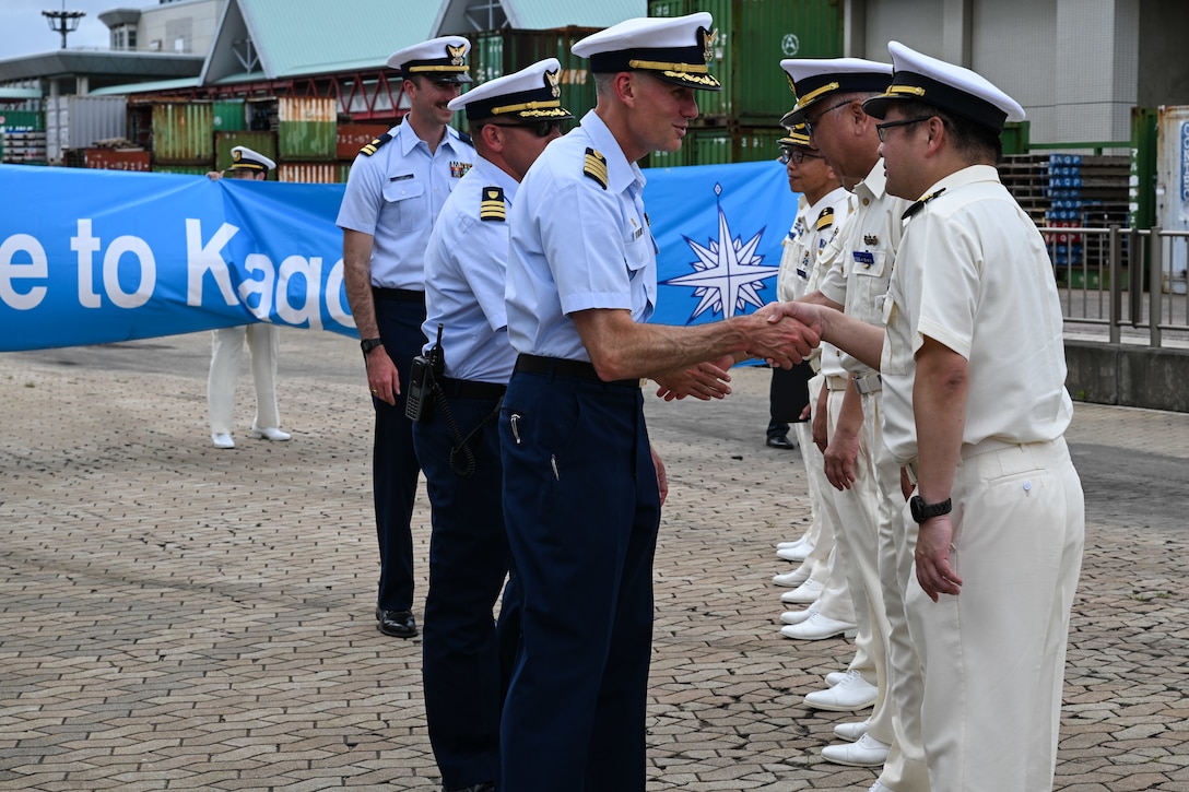U.S. Coast Guard Capt. Brian Krautler, left, commanding officer of the Legend-class U.S. Coast Guard Cutter Stratton (WMSL 752), shakes hands with members of the Japanese coast guard at a welcome ceremony in Kagoshima, Japan, June 16, 2025, during a trilateral exercise with Japan and Philippine Coast Guard. Stratton is deployed and assigned to Destroyer Squadron (DESRON) 15, the Navy’s largest DESRON and the U.S. 7th Fleet’s principal surface force. Stratton is deployed to the Indo-Pacific to advance relationships with ally and partner nations to build a more secure and prosperous region with unrestricted, lawful access to the maritime commons. (U.S. Coast Guard photo by Petty Officer 2nd Class Kate Kilroy)