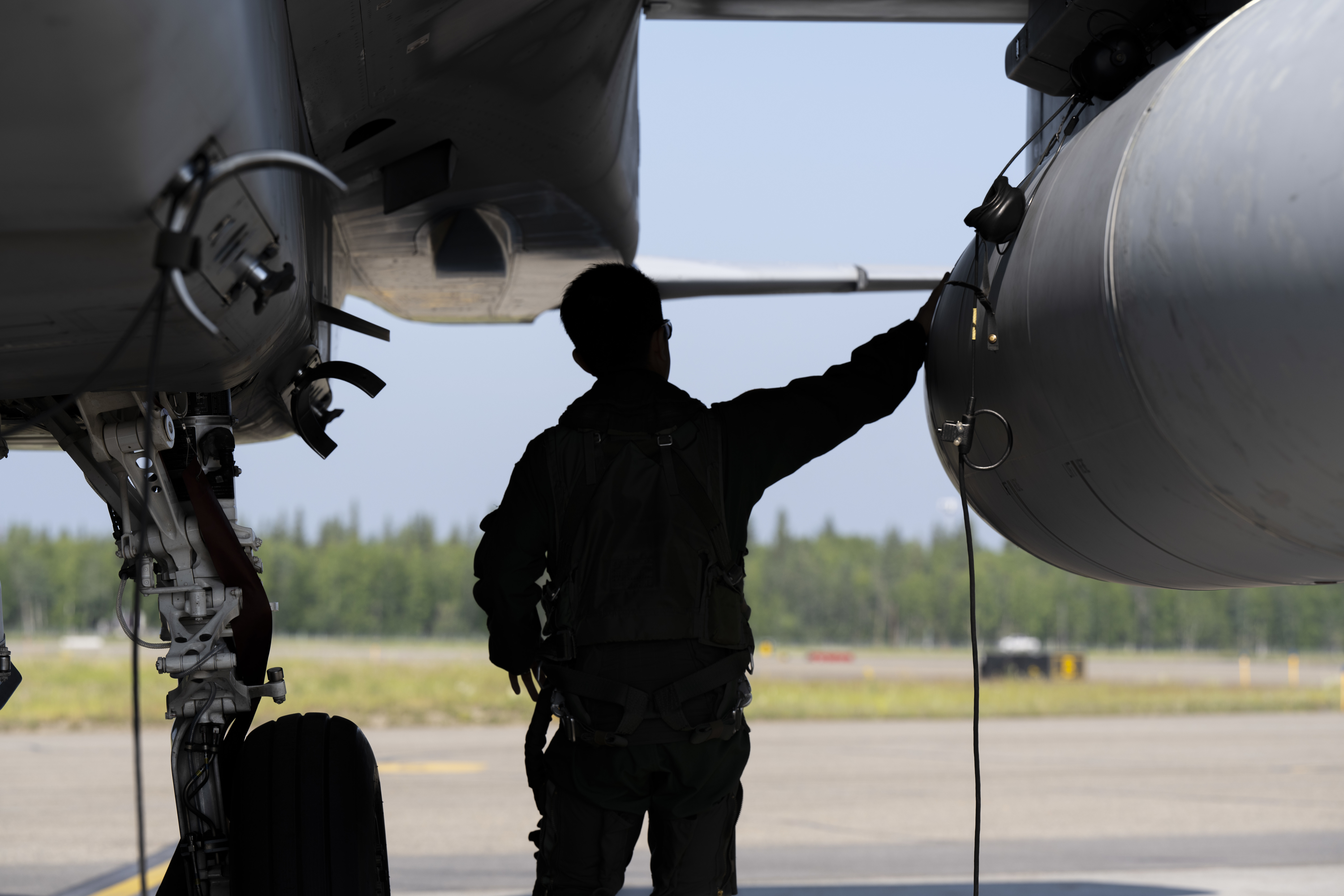 A Japan Air Self-Defense Force F-15J Eagle pilot performs pre-flight inspections prior to takeoff during Red Flag-Alaska 25-2 at Eielson Air Force, Alaska, June 17, 2025. The exercise strengthens interoperability between the U.S. and Japan while enhancing readiness for real-world operations. (U.S. Air Force photo by Staff Sgt. Daniel Brosam)