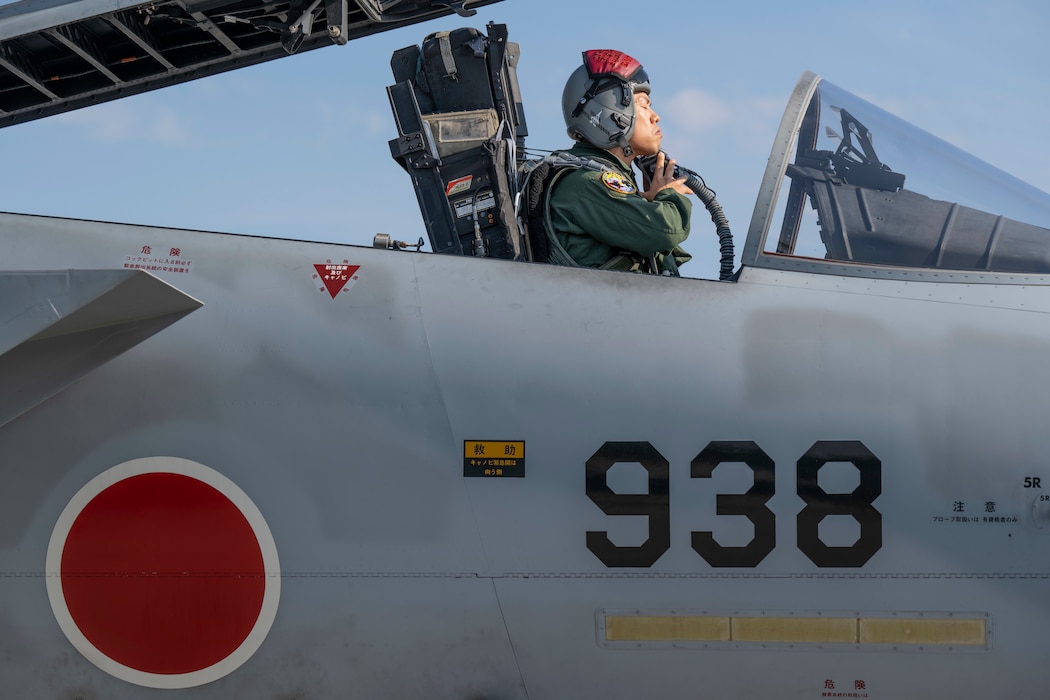 A Japan Air Self-Defense Force F-15J Eagle pilot dons his oxygen mask prior to departure during Red Flag-Alaska 25-2 at Eielson Air Force, Alaska, June 17, 2025.