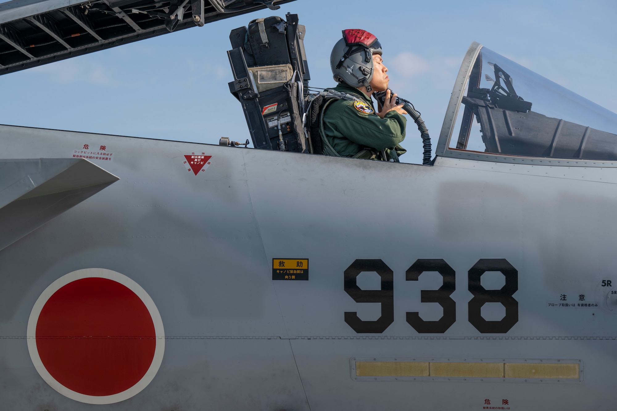 A Japan Air Self-Defense Force F-15J Eagle pilot dons his oxygen mask prior to departure during Red Flag-Alaska 25-2 at Eielson Air Force, Alaska, June 17, 2025.