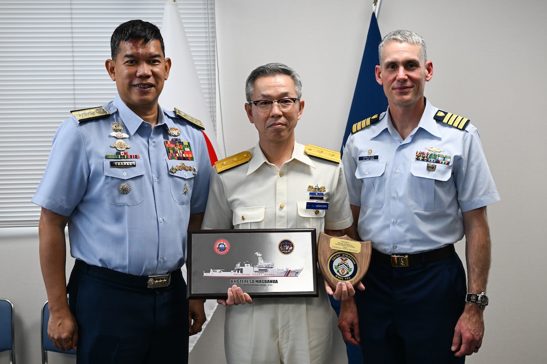 From left to right, Vice Adm. Edgar Ybanez, deputy commandant for Operations Philippine Coast Guard, Rear Adm. Hamahira Kiyoshi, chief, Kagoshima Japan Coast Guard Office, and U.S. Coast Guard Capt. Brian Krautler, commanding officer of the Legend-class Coast Guard Cutter Stratton (WMSL 752), pose for a photo at the Kagoshima Coast Guard office in Kagoshima, Japan, June 16, 2025. Stratton is deployed and assigned to Destroyer Squadron (DESRON) 15, the Navy’s largest DESRON and the U.S. 7th Fleet’s principal surface force. Stratton is deployed to the Indo-Pacific to advance relationships with ally and partner nations to build a more secure and prosperous region with unrestricted, lawful access to the maritime commons. (U.S. Coast Guard photo by Petty Officer 2nd Class Kate Kilroy)