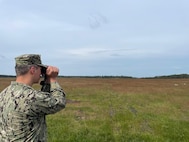 Hospital Corpsman 1st Class Nicolas Garhartt, assigned to Navy Environmental Preventive Medicine Unit TWO (NEPMU-2), conduct vector surveillance operations through open terrain during BALTOPS25 in Rinkaby, Sweden, June 19, 2025. BALTOPS 25 is the premier maritime-focused annual military exercise in the Baltic region and provides a unique opportunity to strengthen warfighting readiness and combat credibility critical to deterrence and preserving safety and security in the Baltic Sea.