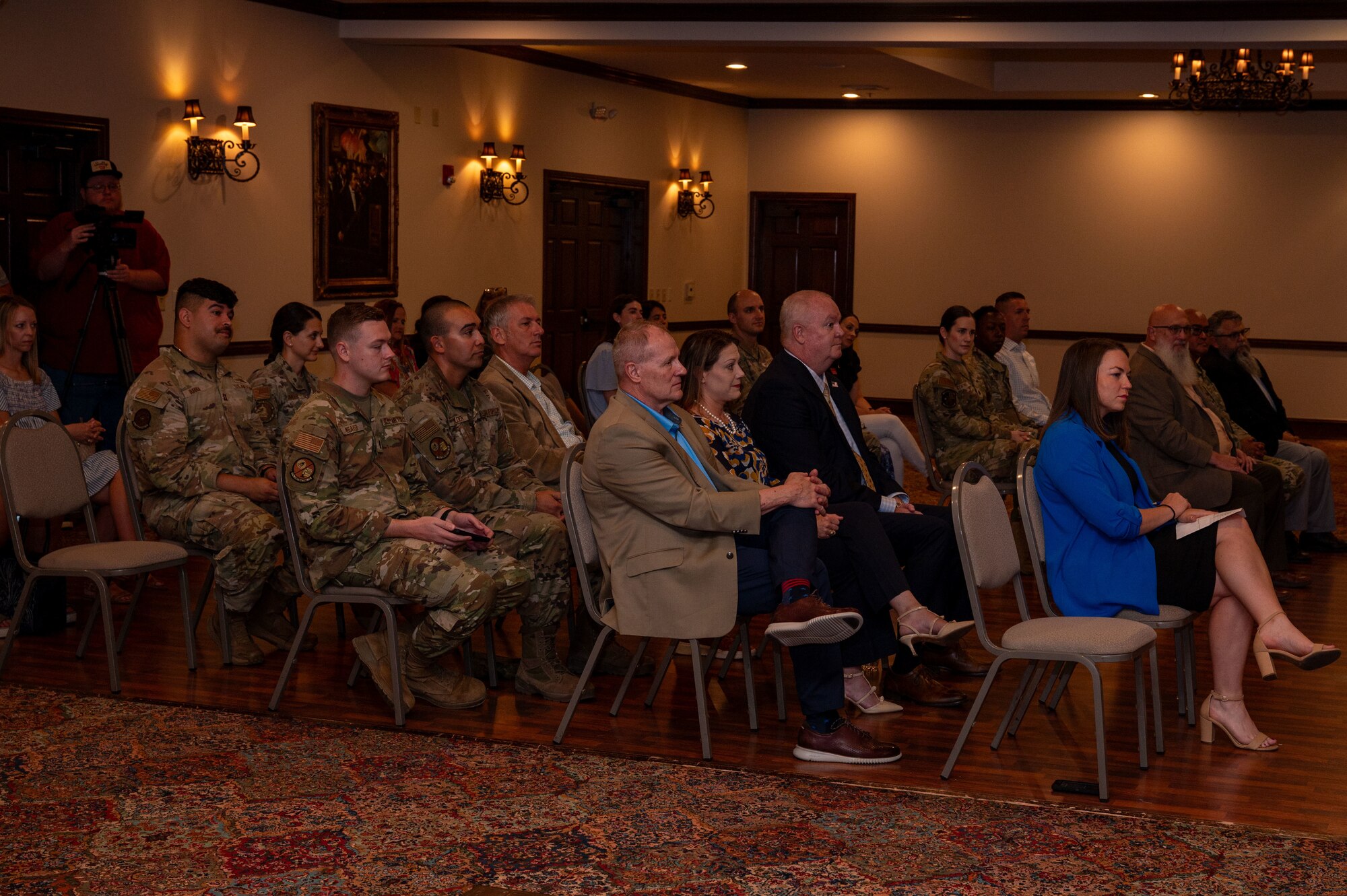 Members of both the San Angelo and Goodfellow Air Force Base community attend the Memorandum of Understanding signing event at the LeGrand Visitors and Alumni Center, San Angelo Texas, June 18, 2025. The ongoing partnerships between the San Angelo community and Goodfellow AFB have generate widespread benefits, enhancing educational opportunities and cultivating innovation within the region. (U.S. Air Force photo by Airman 1st Class James Salellas)