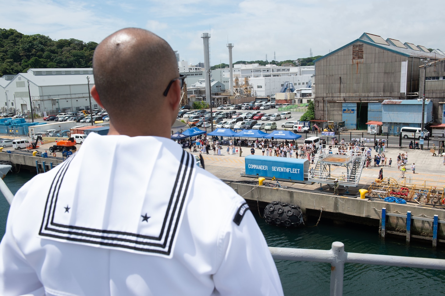 YOKOSUKA, Japan (June 23, 2025) – Friends and family of Sailors aboard U.S. 7th Fleet flagship USS Blue Ridge (LCC 19) observe the ship’s return to Commander Fleet Activities Yokosuka following a summer patrol, June 23. The Blue Ridge and embarked U.S. 7th Fleet staff conduct regular Indo-Pacific patrols to deter aggression, strengthen alliances and partnerships, and advance future warfighting capabilities. (U.S. Navy photo by Mass Communication Specialist 3rd Class Thomas Furnish)