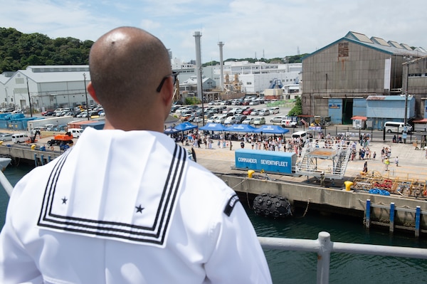 YOKOSUKA, Japan (June 23, 2025) – Friends and family of Sailors aboard U.S. 7th Fleet flagship USS Blue Ridge (LCC 19) observe the ship’s return to Commander Fleet Activities Yokosuka following a summer patrol, June 23. The Blue Ridge and embarked U.S. 7th Fleet staff conduct regular Indo-Pacific patrols to deter aggression, strengthen alliances and partnerships, and advance future warfighting capabilities. (U.S. Navy photo by Mass Communication Specialist 3rd Class Thomas Furnish)