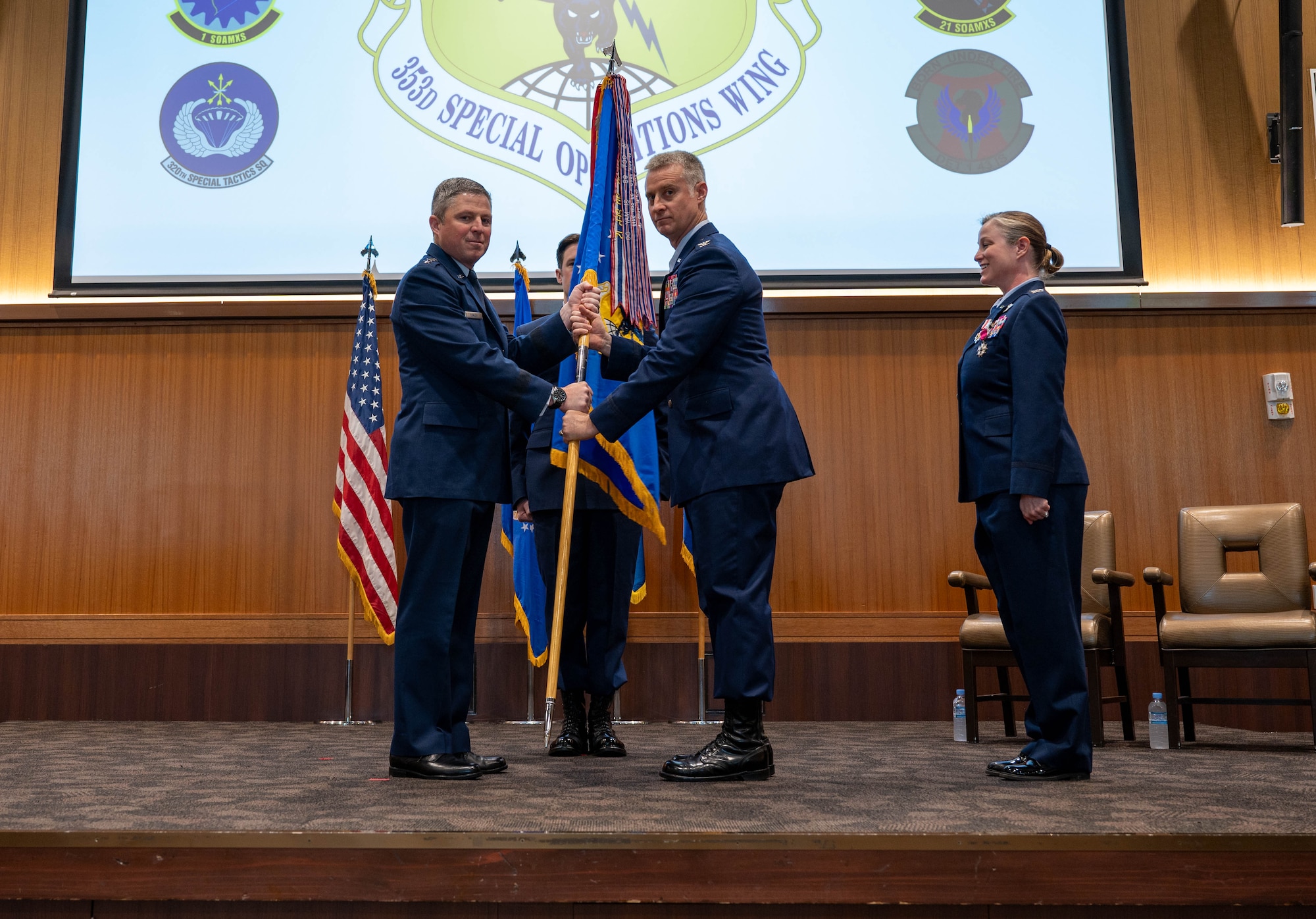 Guidon being passed to incoming commander.