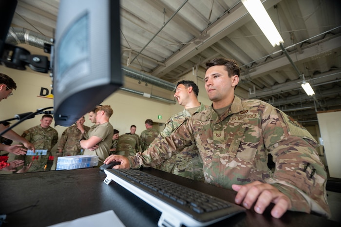 U.S. Air Force Tech. Sgt. Robert Gonzalez, 35th Civil Engineer Squadron Rapid Airfield Damage Repair (RADR) training table instructor, operates the RADR tabletop system at Misawa Air Base, Japan, June 18, 2025.