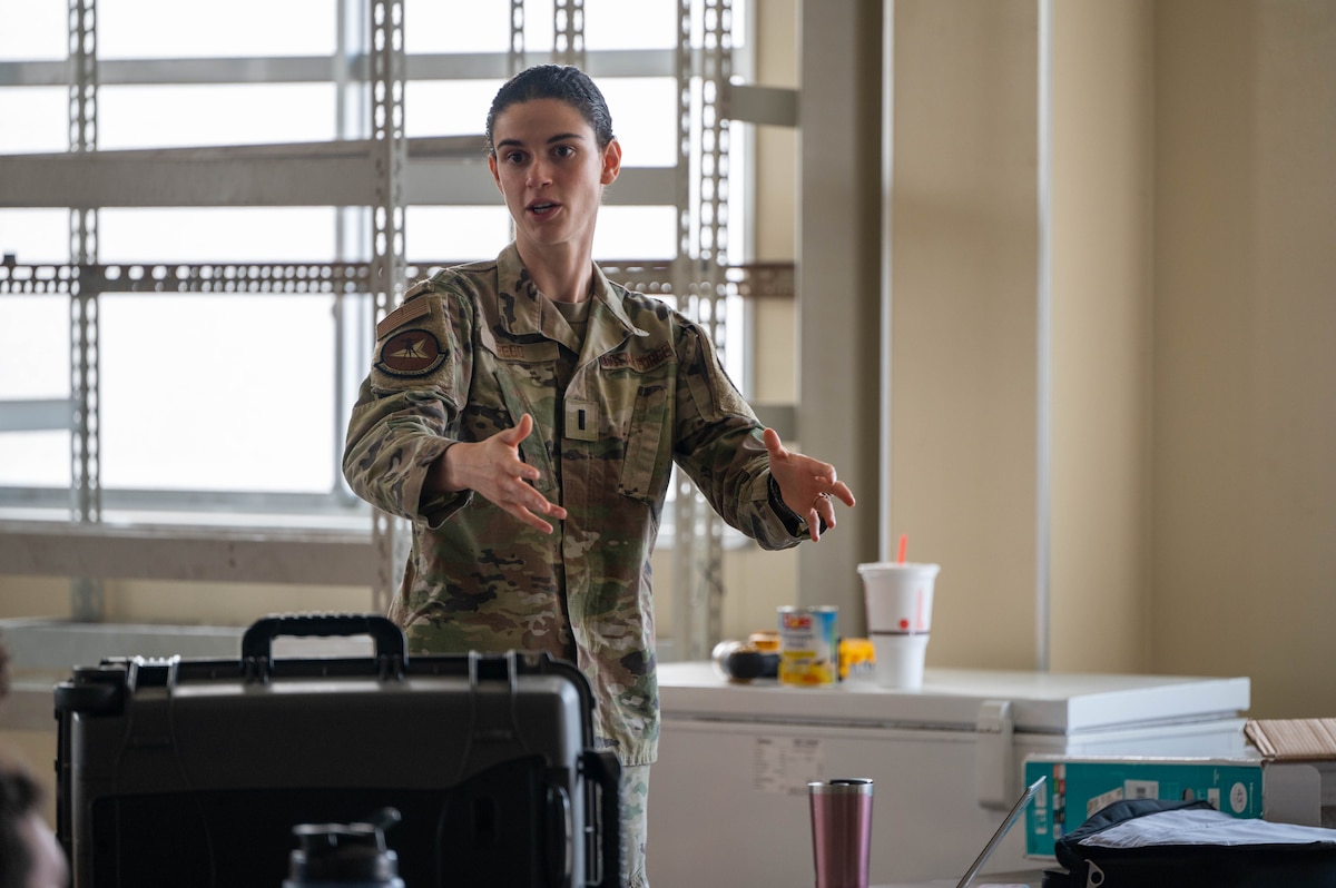 U.S. Air Force 1st Lt. Sarah Rego, 35th Civil Engineer Squadron Rapid Airfield Damage Repair (RADR) officer in charge, briefs Airmen on the RADR process at Misawa Air Base, Japan, June 18, 2025.