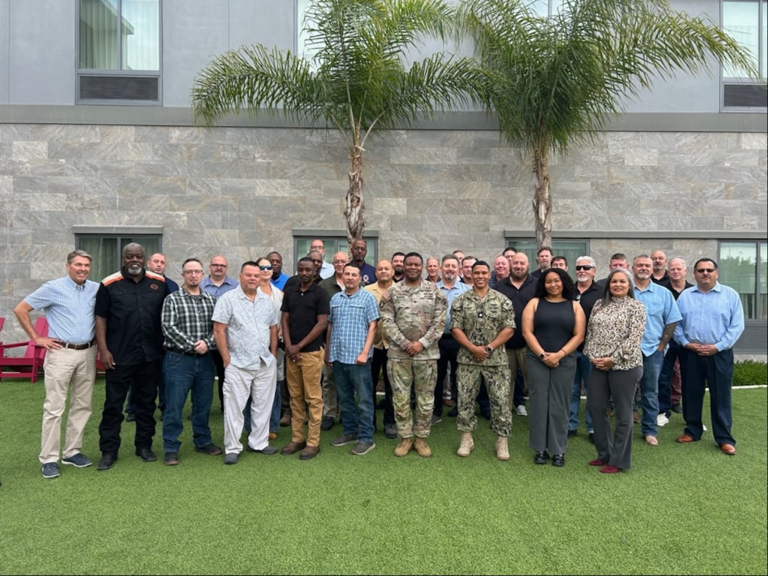 Group of DLA Energy employees pose for photo.