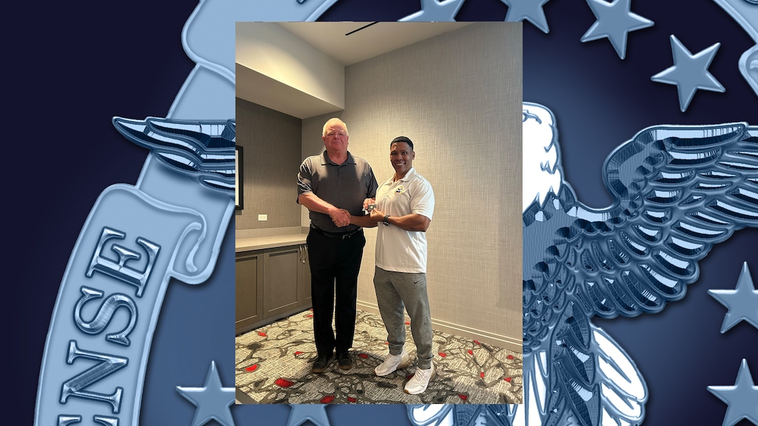 Former DLA Energy employee is recognized.