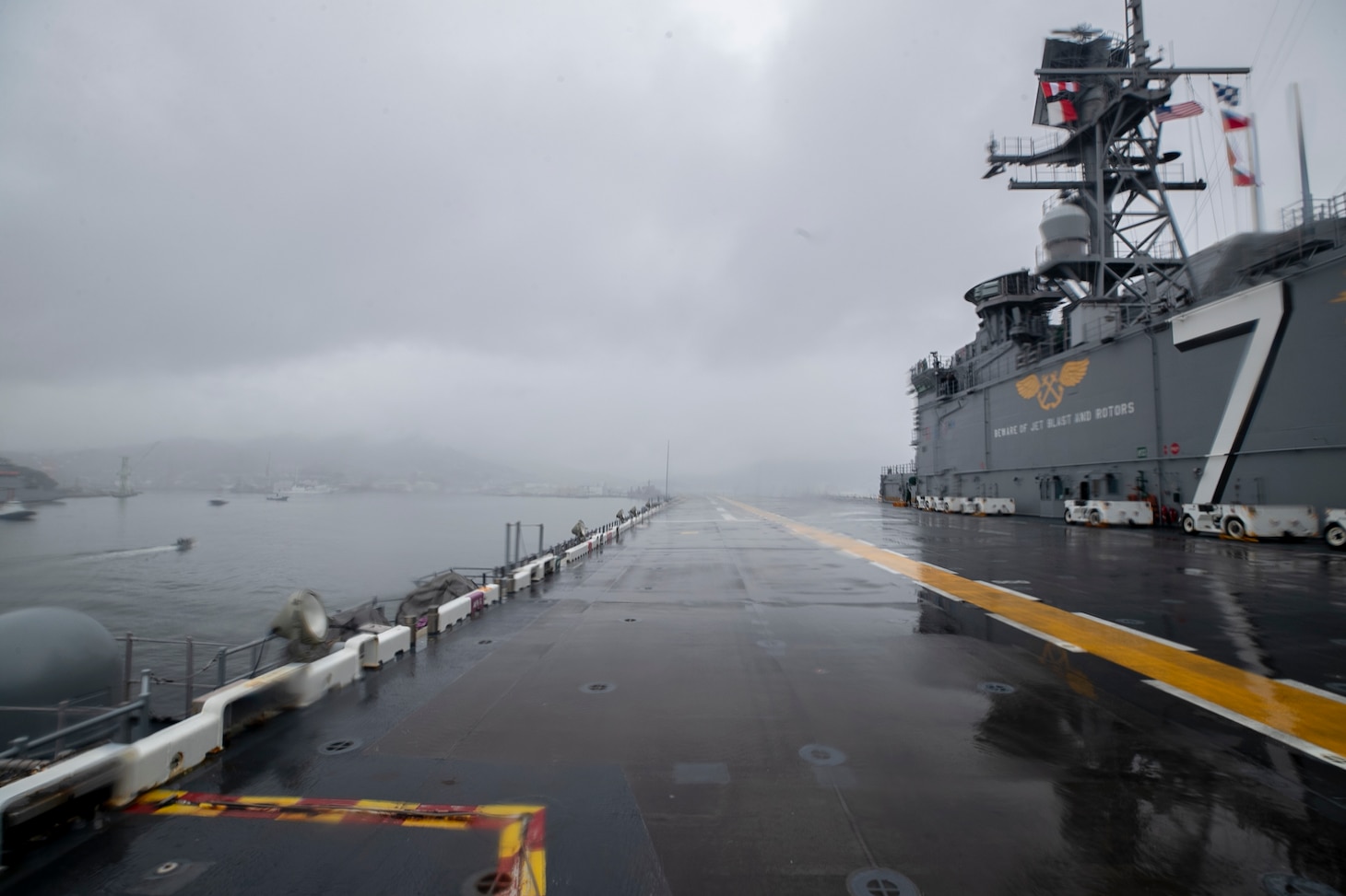 SASEBO, Japan (June 23, 2025) – The America-class amphibious assault ship USS Tripoli (LHA 7) arrives in Sasebo, Japan June 23, 2025. USS Tripoli (LHA 7) is forward deployed to Sasebo, Japan, and operates in U.S. 7th Fleet, the U.S. Navy’s largest forward-deployed numbered fleet, which routinely interacts and operates with allies and partners in preserving a free and open Indo-Pacific region. (U.S. Navy photo by Mass Communication Specialist 1st Class Danian C. Aiko-Douglas)