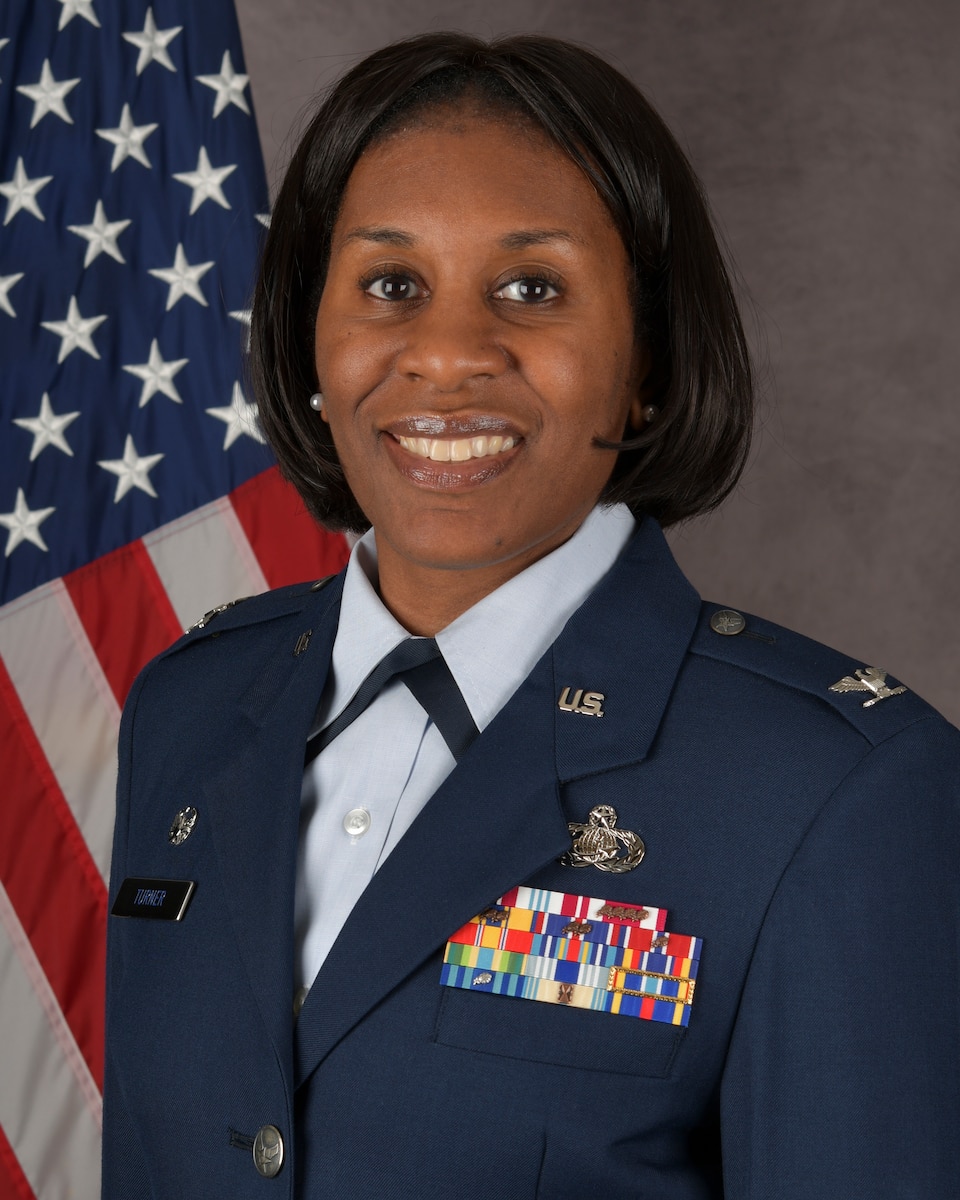 a woman poses for an official photo, MSG CC