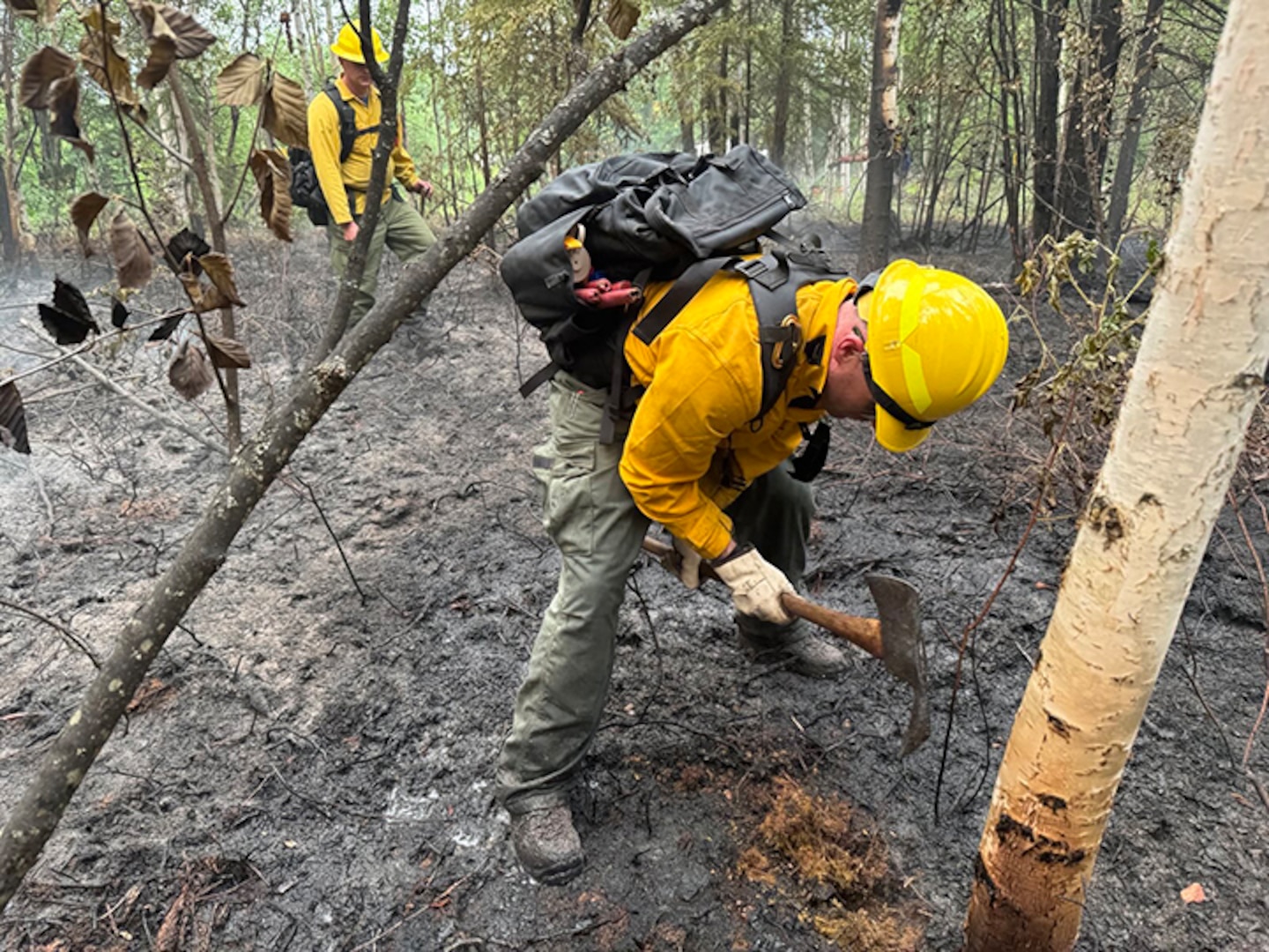 Alaska Air National Guard Senior Airman Jody Doyon, 176th Civil Engineer Squadron firefighter, supports wildfire containment efforts June 21, 2025, at Bear Creek, Alaska.