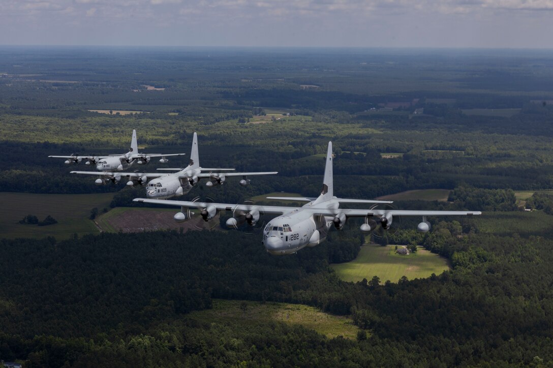 U.S. Marines with Marine Aerial Refueler Transport Squadron (VMGR) 252 fly KC-130J Super Hercules in formation near Marine Corps Air Station Cherry Point, North Carolina, June 18, 2025. VMGR-252 conducted surge operations to exercise their ability to launch and recover multiple divisions of aircraft concurrently. (U.S. Marine Corps photo by Lance Cpl. Bryan Giraldo)