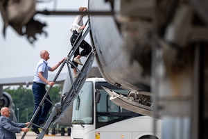 NATO chaplains tour aircraft.