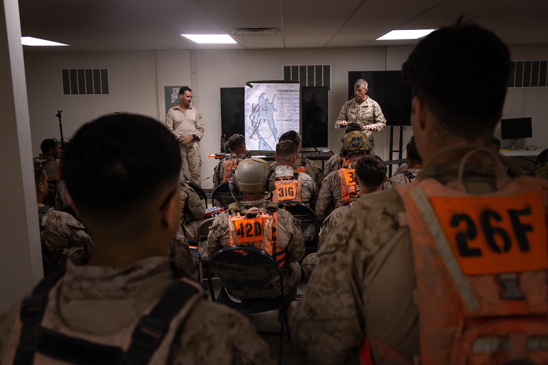 U.S. Marine Corps Brig. Gen. John K. Jarrard, commanding general of 4th Marine Division, speaks to Marines with the Tactical Training Exercise Control Group, Marine Air-Ground Task Force Training Command, at Integrated Training Exercise 3-25 (ITX 3-25) at Marine Corps Air Ground Combat Center, Twentynine Palms, California, June 15th, 2025. ITX enhances Marines’ lethality by empowering leaders at every level to adapt, communicate, and execute dynamic movements in hostile environments. (U.S. Marine Corps photo by Lance Cpl. Edward Spears)