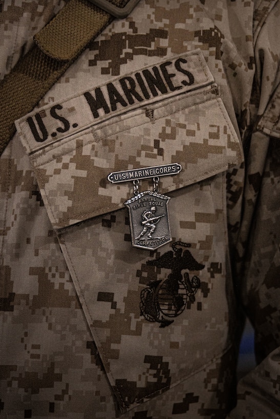 U.S. Marine Corps Brig. Gen. John K. Jarrard, commanding general of 4th Marine Division, awards Marines with 1st Battalion, 23rd Marine Regiment at Integrated Training Exercise 3-25 (ITX 3-25) at Marine Corps Air Ground Combat Center, Twentynine Palms, California, June 15th, 2025. The medal was awarded for winners of a squad competition that tested Marines' physical fitness levels, tactical proficiency, and unit cohesion. ITX is a critical Marine Air-Ground Task Force exercise for the Marine Forces Reserve’s training cycle, confirming unit readiness through live-fire and combined arms integration. (U.S. Marine Corps photo by Lance Cpl. Edward Spears)