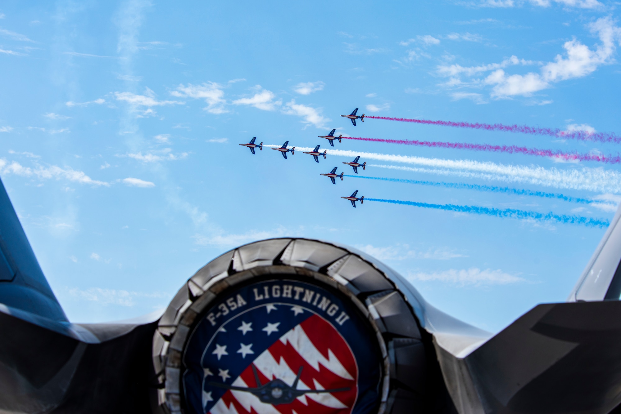Six jets flying from the view of a F-35A