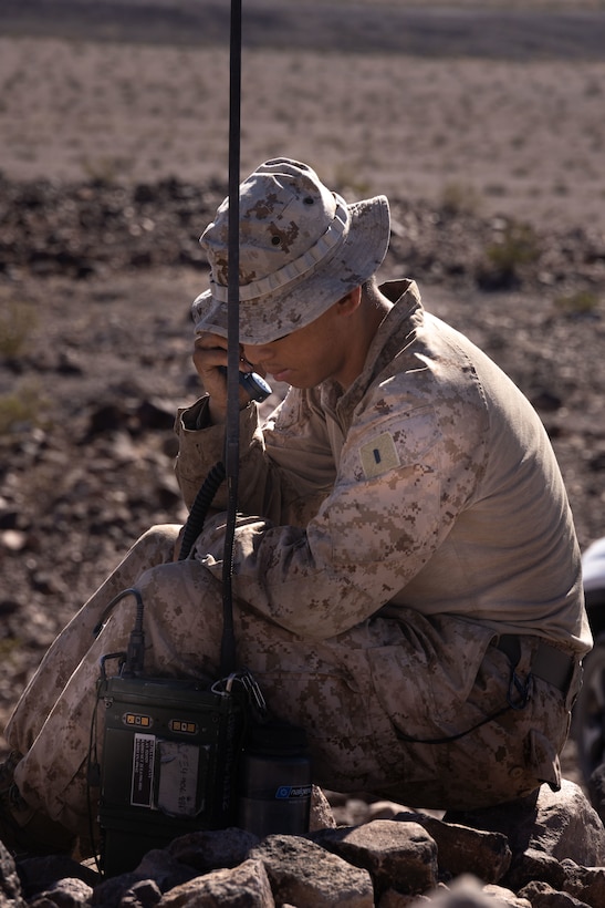 U.S. Marine Corps 1st Lt. Johnathon Trinh, an executive officer in 4th Light Armored Reconnaissance Battalion, 4th Marine Division, executes radio communication during Integrated Training Exercise 3-25 (ITX 3-25) at Marine Corps Air Ground Combat Center, Twentynine Palms, California, June 16th, 2025. ITX is a critical Marine Air-Ground Task Force exercise for the Marine Forces Reserve’s training cycle, confirming unit readiness through live-fire and combined arms integration. (U.S. Marine Corps photo by Lance Cpl. Edward Spears)