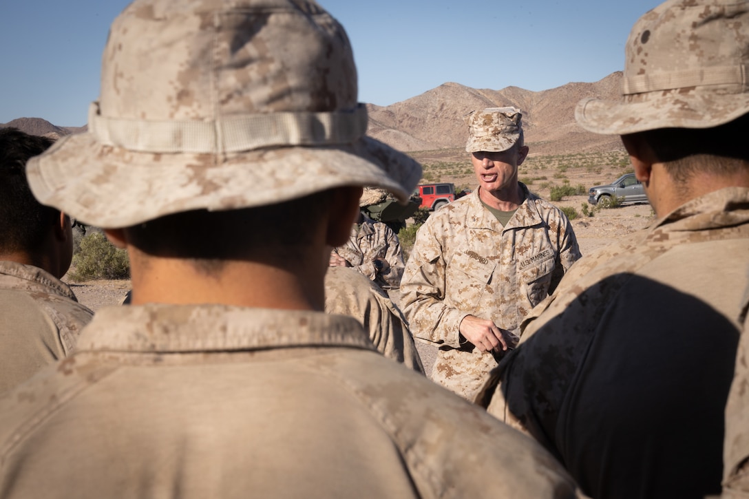 U.S. Marine Corps Brig. Gen. John K. Jarrard, commanding general of 4th Marine Division, speaks to Marines with 4th Light Armored Reconnaissance Battalion, 4th Marine Division at Integrated Training Exercise 3-25 (ITX 3-25) at Marine Corps Air Ground Combat Center, Twentynine Palms, California, June 16th, 2025. ITX is a critical Marine Air-Ground Task Force exercise for the Marine Forces Reserve’s training cycle, confirming unit readiness through live-fire and combined arms integration. (U.S. Marine Corps photo by Lance Cpl. Edward Spears)
