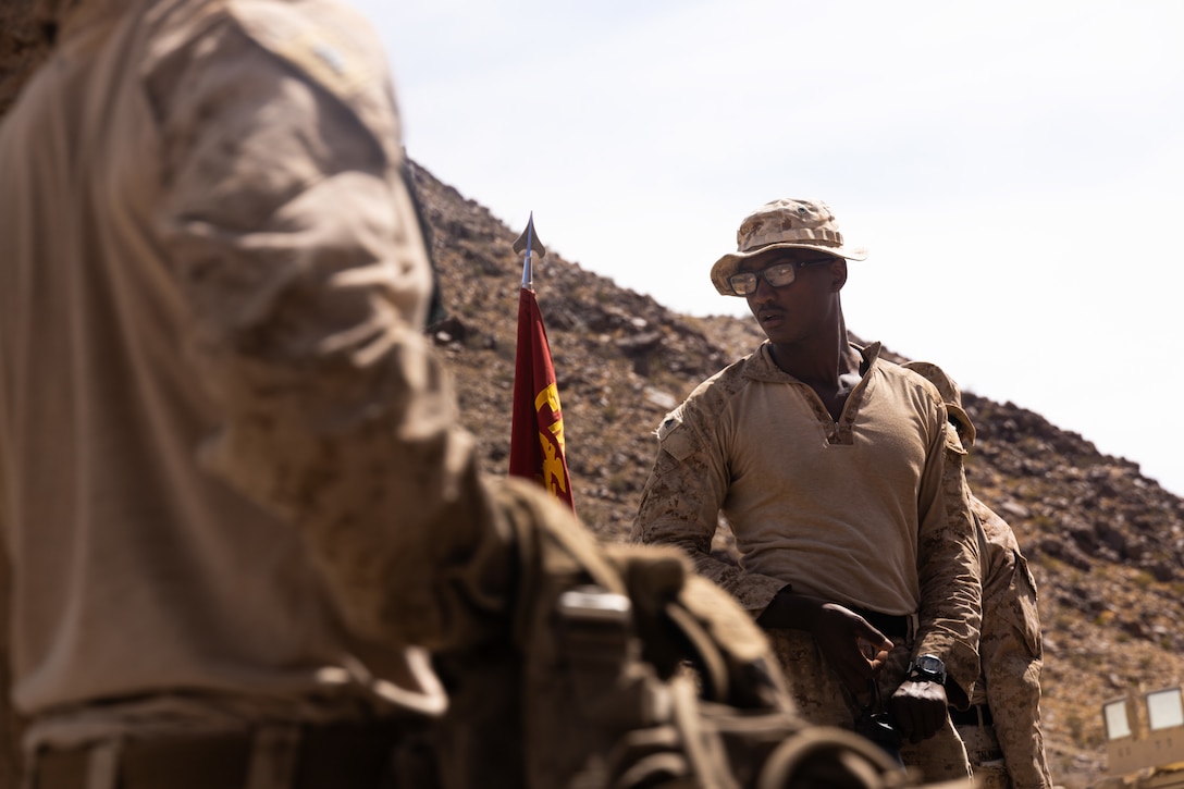 U.S. Marine Corps Cpl. Mitchell Turner, a squad leader with 1st Battalion, 23rd Marine Regiment, 4th Marine Division, directs Marines during Integrated Training Exercise 3-25 (ITX 3-25) on Marine Corps Air Ground Combat Center, Twentynine Palms, California, June 14, 2025. ITX is a critical Marine Air-Ground Task Force exercise for the Marine Forces Reserve’s training cycle, confirming unit readiness through live-fire and combined arms integration. (U.S. Marine Corps photo by Lance Cpl. Edward Spears)