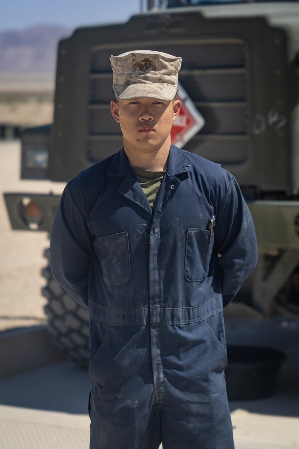 U.S. Marine Corps Pfc. Li Chen, an automotive maintenance technician with Combat Logistics Battalion 25, 4th Marine Logistics Group, poses for a photo during Integrated Training Exercise 3-25 (ITX 3-25) on Marine Corps Air Ground Combat Center, Twentynine Palms, California, June 13, 2025. ITX is a critical Marine Air-Ground Task Force exercise for the Marine Forces Reserve’s training cycle, confirming unit readiness through live-fire and combined arms integration. (U.S. Marine Corps photo by Cpl. Isaiah W. Smith)