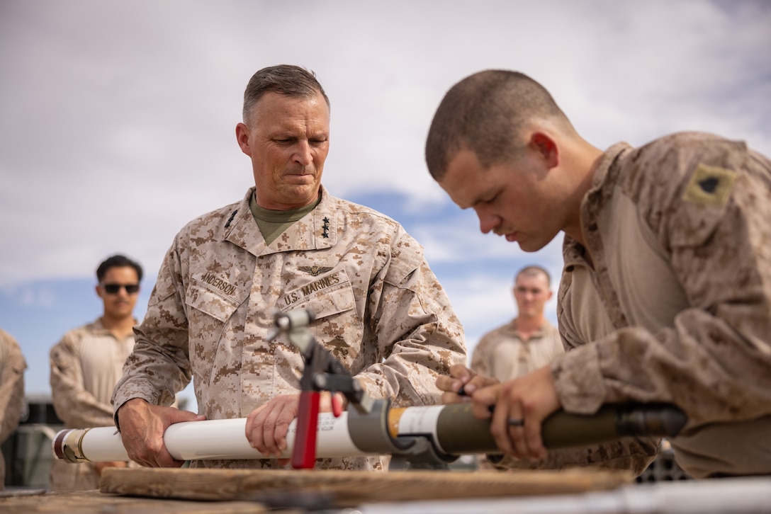 U.S. Marine Corps Lt. Gen. Leonard F. Anderson IV, commander of Marine Forces Reserve, is shown how to assemble air ordnance by Sgt. Austin Klein, an aviation ordnance systems technician with Marine Light Attack Helicopter Squadron 773, Marine Aircraft Group 49, 4th Marine Aircraft Wing, during Integrated Training Exercise 3-25 (ITX 3-25) on Marine Corps Air Ground Combat Center, Twentynine Palms, California, June 14, 2025. ITX is a critical Marine Air-Ground Task Force exercise for the Marine Forces Reserve’s training cycle, confirming unit readiness through live-fire and combined arms integration. (U.S. Marine Corps photo by Staff Sgt. Scott Jenkins)