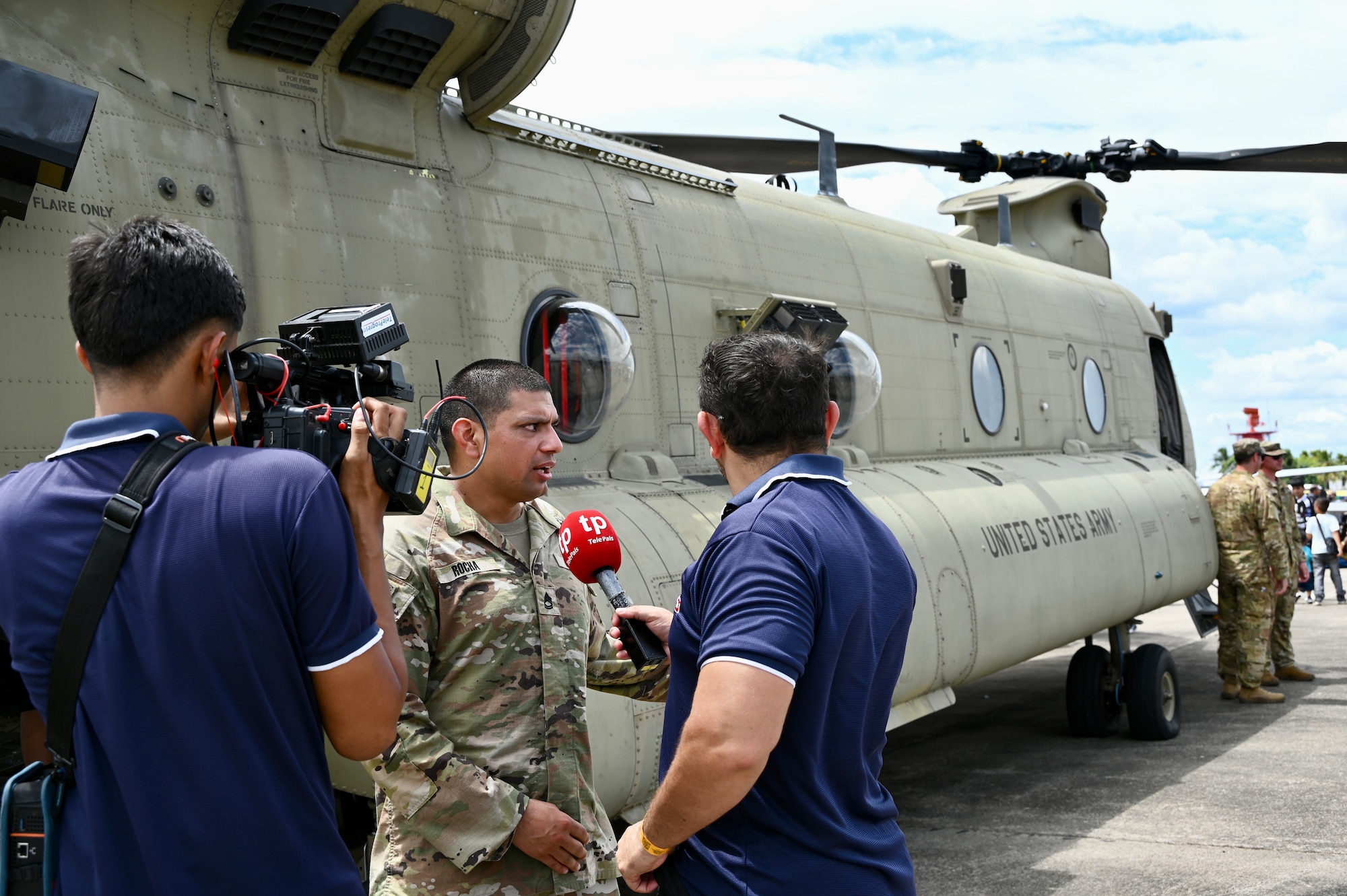 Sgt. 1st Class Juan Rocha, CH-47 flight engineer, is interviewed by local media during the Honduran Fuerza Aerea Air Show
