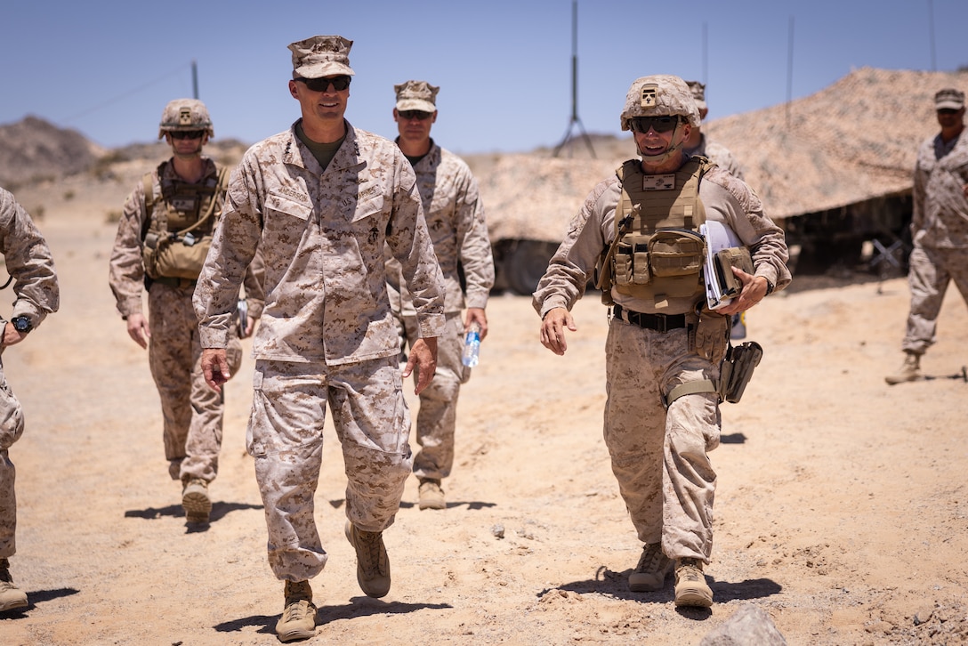 U.S. Marine Corps Lt. Gen. Leonard F. Anderson IV, commander of Marine Forces Reserve (left), walks with Col. David Fleming, commander of Marine Air-Ground Task Force 25, during Integrated Training Exercise 3-25 (ITX 3-25) on Marine Corps Air Ground Combat Center, Twentynine Palms, California, June 14, 2025. ITX is a critical Marine Air-Ground Task Force exercise for the Marine Forces Reserve’s training cycle, confirming unit readiness through live-fire and combined arms integration. (U.S. Marine Corps photo by Staff Sgt. Scott Jenkins)