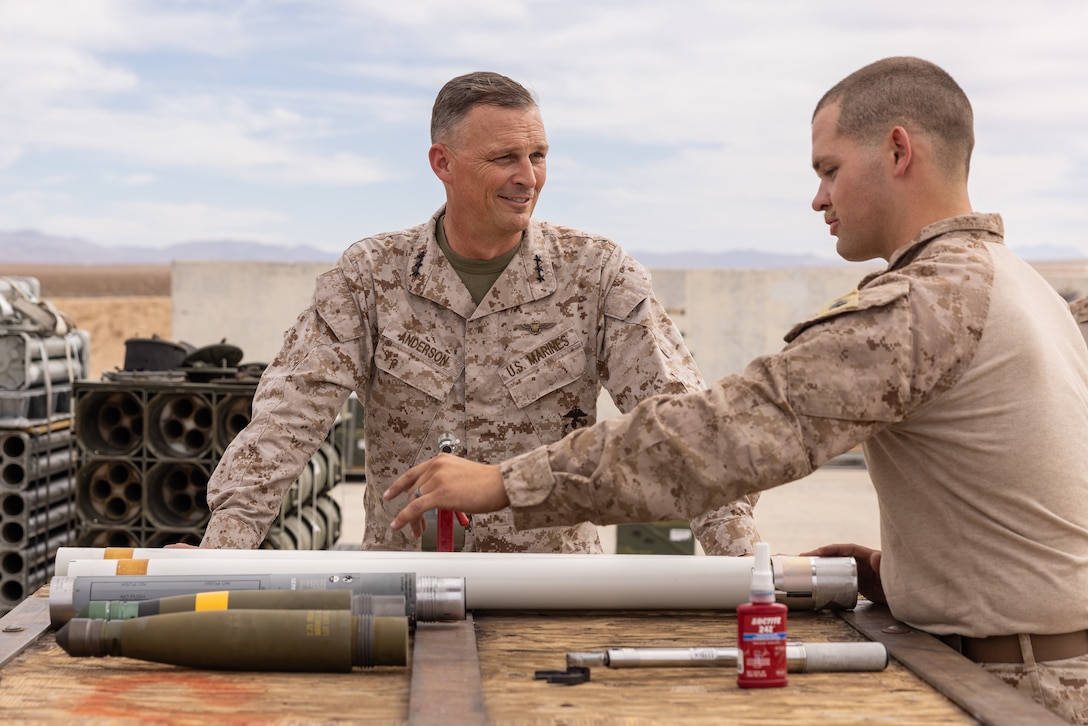 U.S. Marine Corps Lt. Gen. Leonard Anderson IV, commander of Marine Forces Reserve, is shown how to assemble air ordnance by Sgt. Austin Klein, an aviation ordnance systems technician with Marine Light Attack Helicopter Squadron 773, Marine Aircraft Group 49, 4th Marine Aircraft Wing, during Integrated Training Exercise 3-25 (ITX 3-25) on Marine Corps Air Ground Combat Center, Twentynine Palms, California, June 14, 2025. ITX is a critical Marine Air-Ground Task Force exercise for the Marine Forces Reserve’s training cycle, confirming unit readiness through live-fire and combined arms integration. (U.S. Marine Corps photo by Staff Sgt. Scott Jenkins)