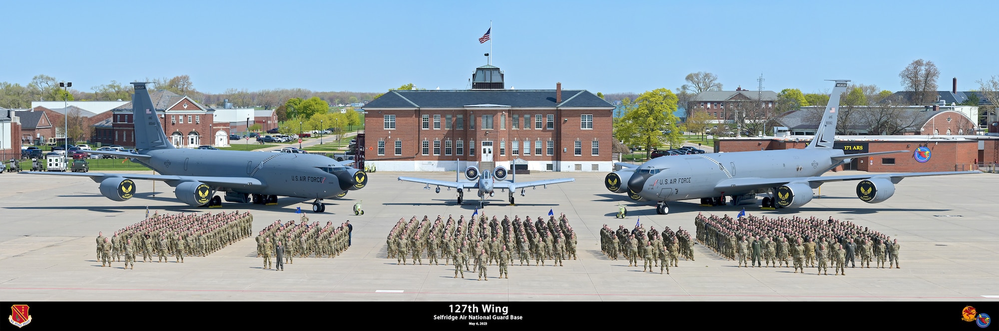 Members of the 127th Wing, Michigan National Guard, stand in formation in front of the KC-135 Stratotanker and A-10 Thunderbolt II aircraft