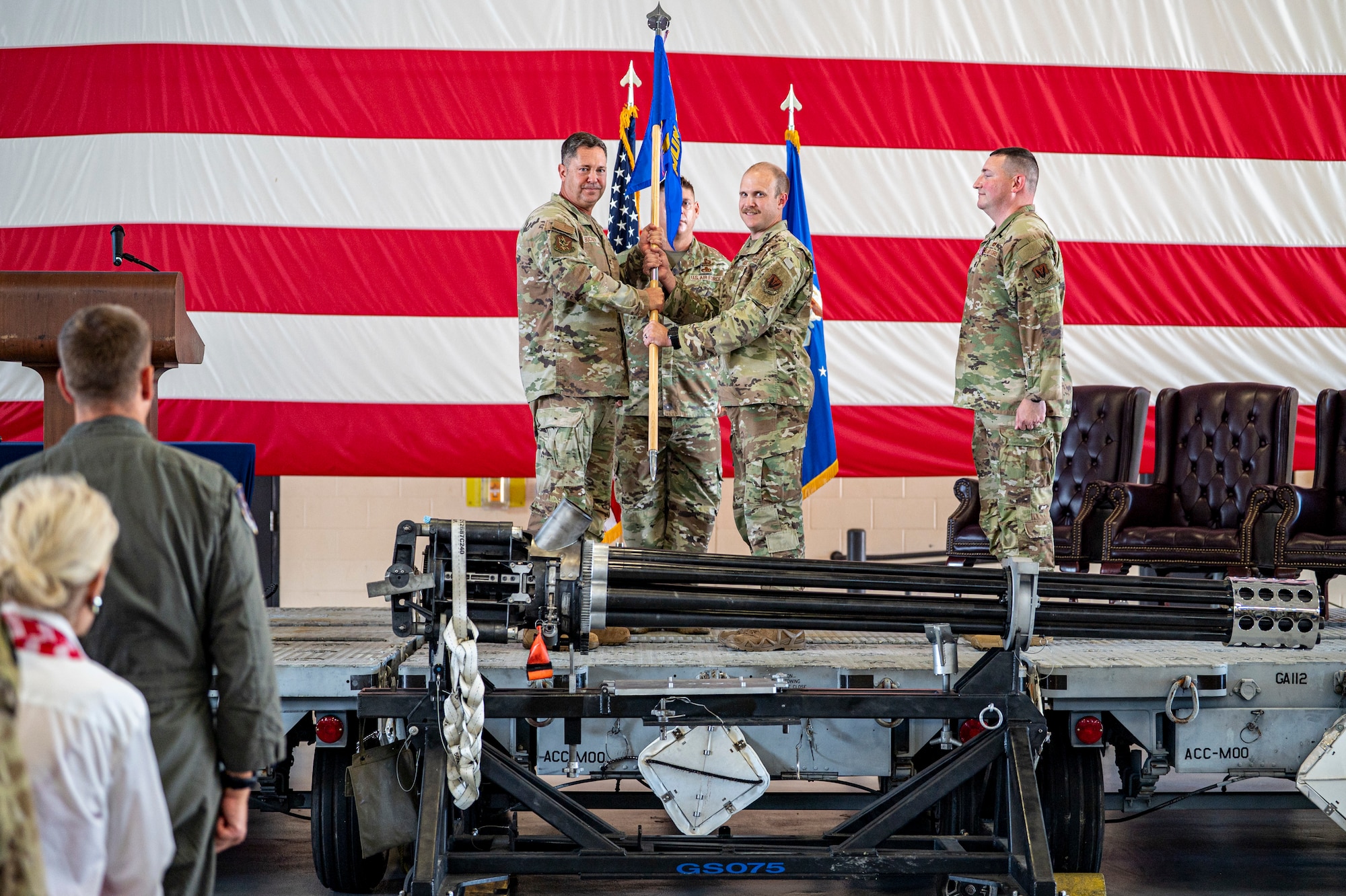 U.S. Air Force Maj. Brian Nagel assumes command of the 23rd Munitions Squadron as he receives a guidon from Col. Bobby Buckner, 23rd Maintenance Group commander, during a change of command ceremony at Moody Air Force Base, Georgia, June 13, 2025. The guidon passing is a time-honored military tradition that symbolizes the formal transfer of command and responsibility from one leader to the next. (U.S. Air Force photo by Senior Airman Leonid Soubbotine)