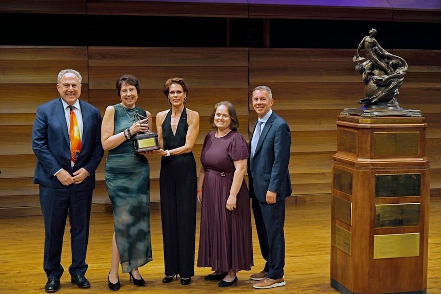 Samantha Magill (NAA vice chair, center) awards the Collier Trophy to Nicki Fox (Associate Administrator, NASA Science Mission Directorate, and former Parker Solar Probe Project Scientist), Andy Driesman (APL),  Betsy Congdon (APL), and Bobby Braun (APL), June 12. The Collier Trophy is on display at the Smithsonian’s Air and Space Museum (Udvar-Hazy Center) and is engraved with the names of all past awardees.