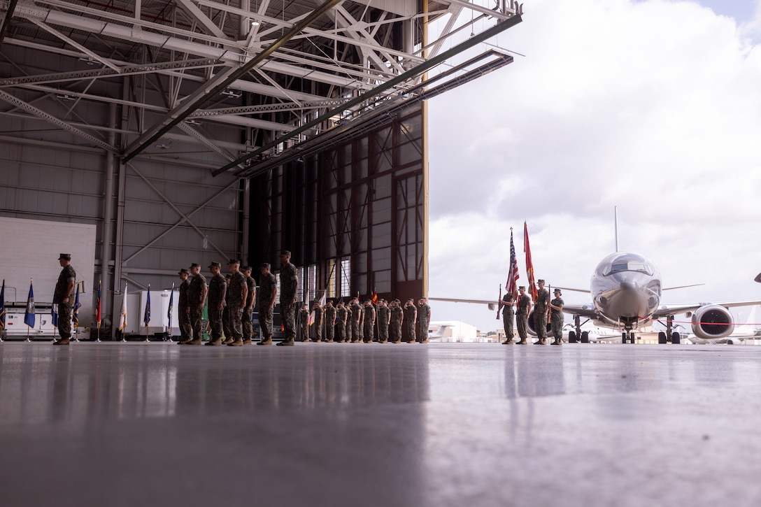 U.S. Marines with Marine Transport Squadron (VMR) 1 hold a ceremony recognizing its classification as a full operational capability squadron at Naval Air Station Joint Reserve Base Fort Worth, Texas, June 18, 2025.  VMR-1’s achievement of full operational capability with the C-40A aircraft, marked a significant milestone in squadron readiness and success. (U.S. Marine Corps photo by Cpl. Kanoa Thomas)