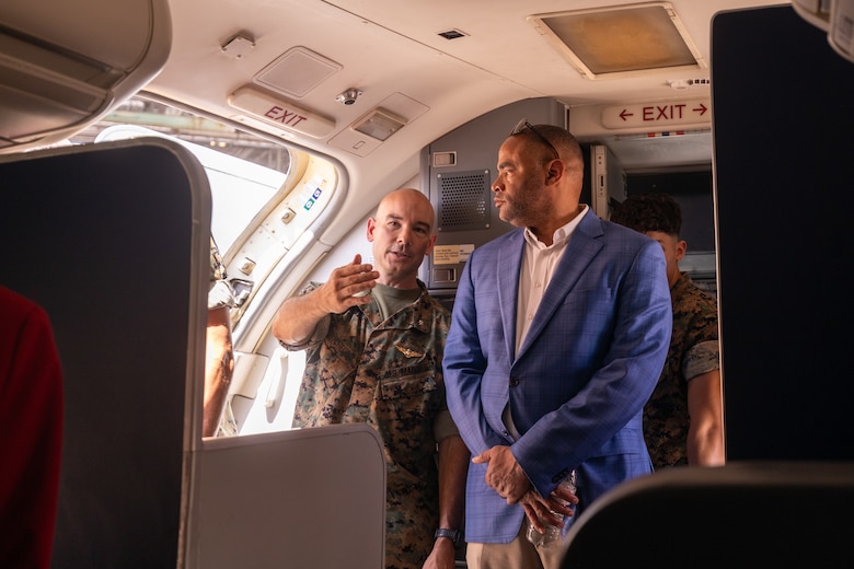 U.S. Rep. Marc Veasey, the representative of Texas’ 33rd Congressional District, receives a tour of the C-40A aircraft from Marine Corps Lt. Col. Hanson W. Pitchford, commanding officer, Marine Transport Squadron (VMR) 1, Marine Aircraft Group 41, 4th Marine Aircraft Wing, Marine Forces Reserve, after a ceremony recognizing VMR-1’S classification as a full operational capability squadron at Naval Air Station Joint Reserve Base Fort Worth, Texas, June 18, 2025.  VMR-1’s achievement of full operational capability with the C-40A aircraft, marks a significant milestone in squadron readiness and success. (U.S. Marine Corps photo by Cpl. Kanoa Thomas)