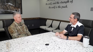 two people sitting at table